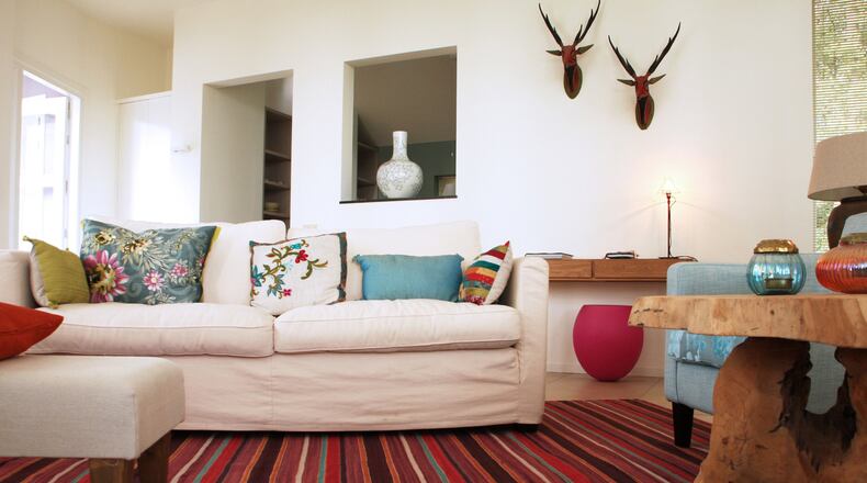 Instead of hoarding decor, try investing in larger pieces that would increase the function and comfort of the home. (Dreamstime)