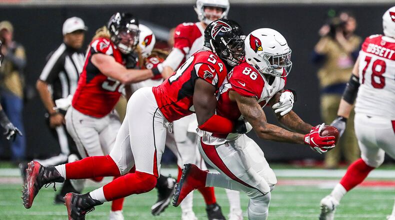 12/16/2018 -- Atlanta, Georgia -- Atlanta Falcons linebacker Foye Oluokun (54) tackles Arizona Cardinals tight end Ricky Seals-Jones (86) after completing a catch during the second half the game at Mercedes-Benz Stadium in Atlanta, Sunday, December 16, 2018.  The Atlanta Falcons beat the Arizona Cardinals, 40-14. (ALYSSA POINTER/ALYSSA.POINTER@AJC.COM)