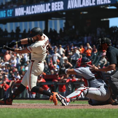 San Francisco Giants' Bryce Eldridge hits a grand slam in front of Washington Nationals catcher Keibert Ruiz during the ninth inning of a baseball game in San Francisco, Wednesday, June 10, 2026. (AP Photo/Jed Jacobsohn)