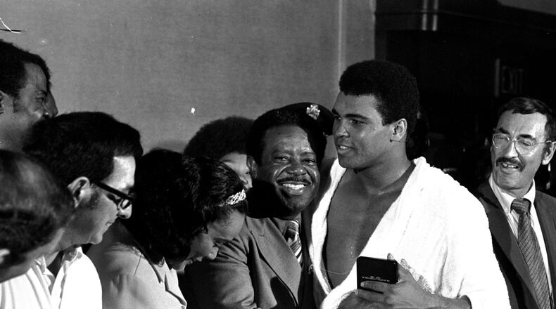 Muhammad Ali is congratulated by Dr. Ralph Abernathy and Coretta Scott King after beating Jerry Quarry in Atlanta on Oct. 26, 1970. (AP Photo)