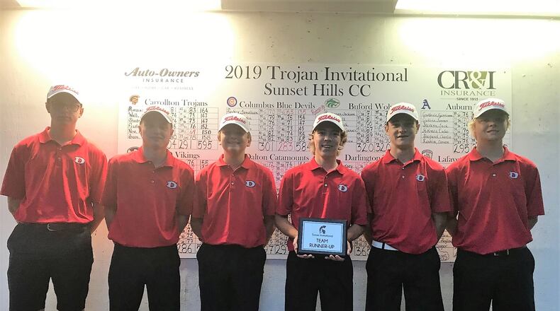 Carter Pendley (holding award) was medalist and Dalton finished second at the Trojan Invitational in Carrollton