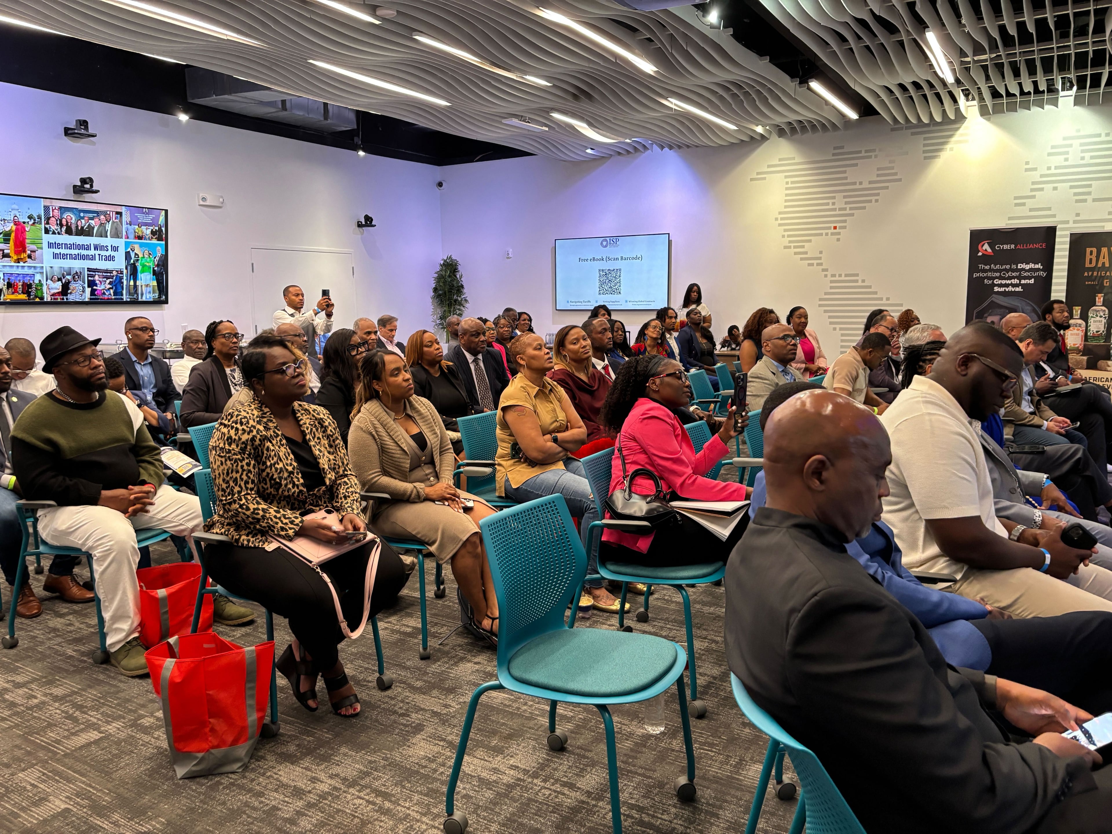 Attendees listen Saturday at Mayday, Agate Solutions' event at the Russell Innovation Center for Entrepreneurs in Atlanta. (Allison Mawn/AJC)