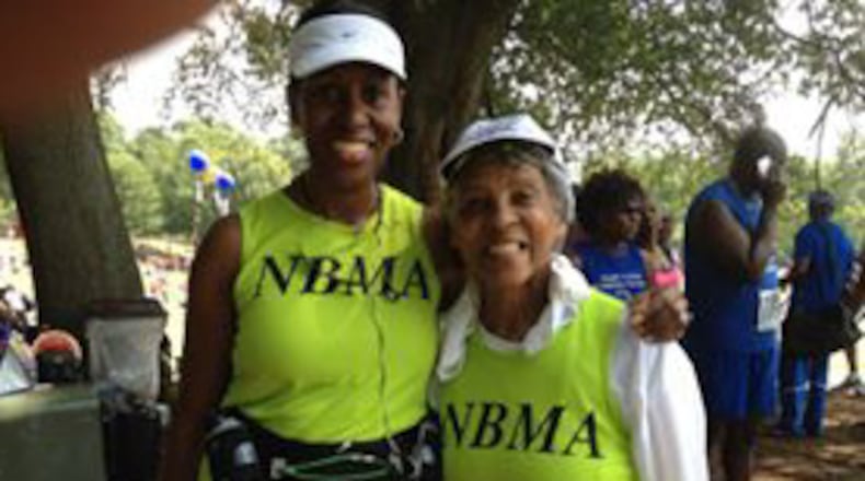 Charlotte Simmons, left, and Frances Gilbert enjoy the close of another successful Atlanta Journal-Constitution Peachtree Road Race.