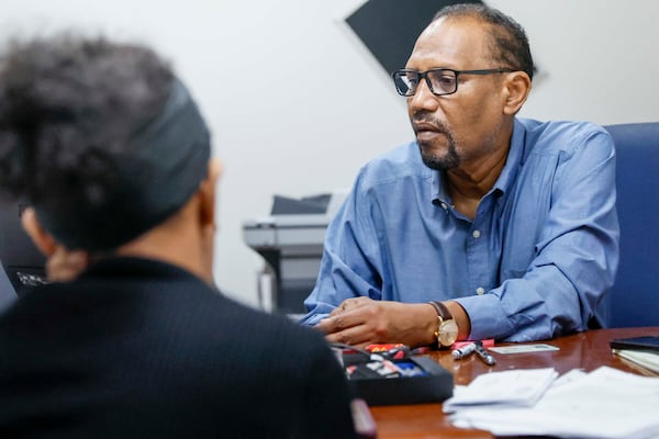  Omar Shekhey, the executive director of the Somali American Community Center, is seen working at his office on Tuesday, June 10, 2025. The Trump administration's sweeping travel ban has impacted the Somali community in Clarkston. (Miguel Martinez/AJC)
