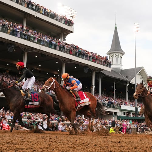 Jockey Jose L. Ortiz celebrates after riding Golden Tempo (19) to victory the 152nd running of the Kentucky Derby horse race at Churchill Downs, Saturday, May 2, 2026, in Louisville, Ky. (AP Photo/Abbie Parr)
