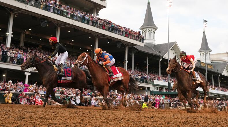 Jockey Jose L. Ortiz celebrates after riding Golden Tempo (19) to victory the 152nd running of the Kentucky Derby horse race at Churchill Downs, Saturday, May 2, 2026, in Louisville, Ky. (AP Photo/Abbie Parr)