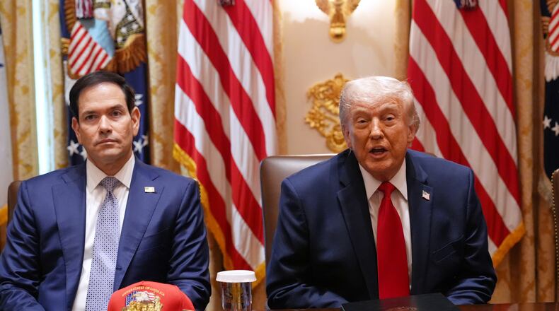 President Donald Trump, next to Secretary of State Marco Rubio, speaks during a Cabinet meeting at the White House, Wednesday, May 27, 2026, in Washington. (AP Photo/Jacquelyn Martin)