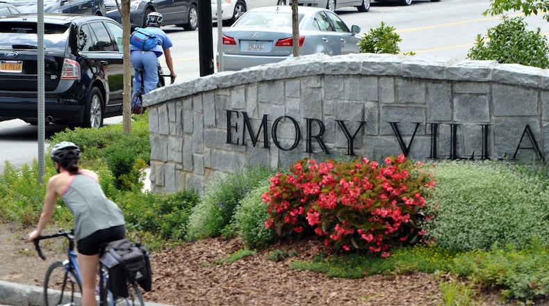 Picture shows a traffic circle, and shops and restaurants in Emory Village near an entrance to Emory University in Atlanta on Thursday, July 31, 2014. HYOSUB SHIN / HSHIN@AJC.COM
