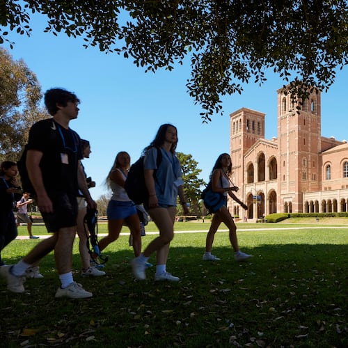 FILE - Students walk past Royce Hall on the University of California, Los Angeles campus on Aug. 15, 2024, in Los Angeles. (AP Photo/Damian Dovarganes, File)