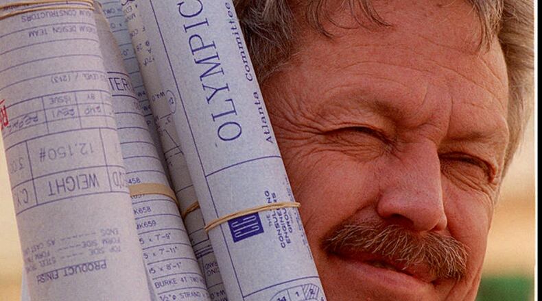 Photo by Joey Ivansco/AJC. slug: OLY-STADIUM-FOUR-COX ATLANTA. George Taft manages the miles of drawings that show builders what to do. (Photo by Joey Ivansco/The Atlanta Journal & Constitution - Cox Newspapers)