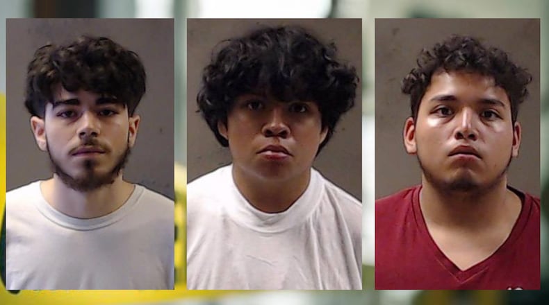Mathew Licht (from left), Alexis Hernandez and Fernando Osorio, all 17, were charged with murder in connection with the killing of two brothers in Dunwoody, police said. A 16-year-old was also arrested, but their identity was not released.