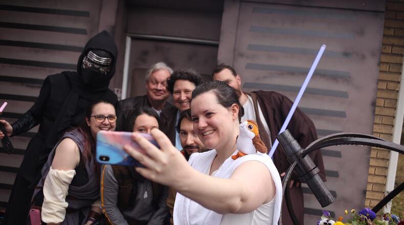 Erin Wert grabs a selfie of her family during a "Star Wars" party at her parents' house. The Wert family dressed up in rebel and Imperial gear, baked Wookiee Cookies and a gingerbread Millennium Falcon in anticipation of the final installment in the "Star Wars" triple trilogy. CONTRIBUTED: MOLLY PRATT