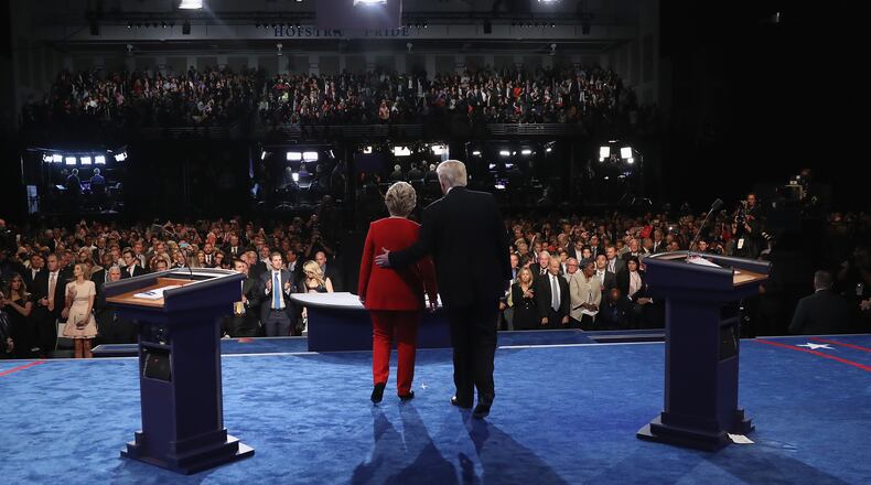 HEMPSTEAD, NY - SEPTEMBER 26: Republican presidential nominee Donald Trump (R) and Democratic presidential nominee Hillary Clinton (L) shake hands after the Presidential Debate at Hofstra University on September 26, 2016 in Hempstead, New York. The first of four debates for the 2016 Election, three Presidential and one Vice Presidential, is moderated by NBC's Lester Holt. (Photo by Joe Raedle/Getty Images)
