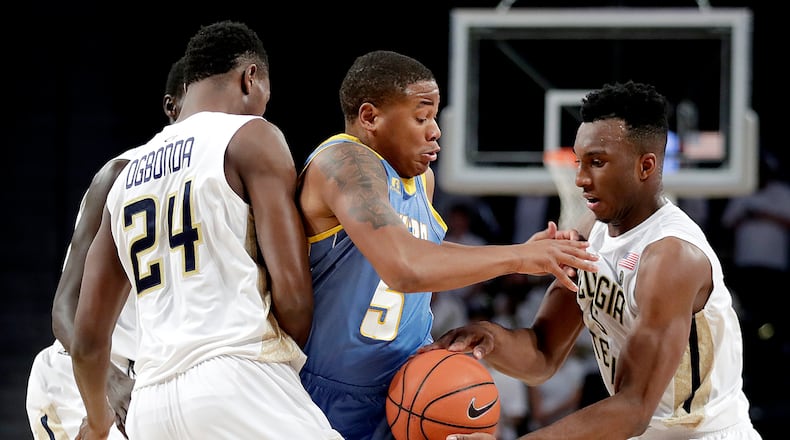 Southern's Brendon Ganaway, center, is stripped of the ball by Georgia Tech's Josh Okogie, right, in the first half of an NCAA college basketball game in Atlanta, Monday, Nov. 14, 2016. (AP Photo/David Goldman)