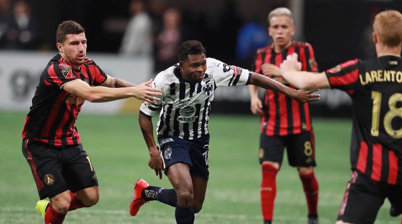 March 13, 2019 Atlanta: Atlanta United midfielder Eric Remedi defends against Monterrey player Aviles Hurtado with Ezequiel Barco and Jeff Larentowicz looking on in a Concacaf Champions league quarterfinal match on Wednesday, March 13, 2019, in Atlanta.    Curtis Compton/ccompton@ajc.com