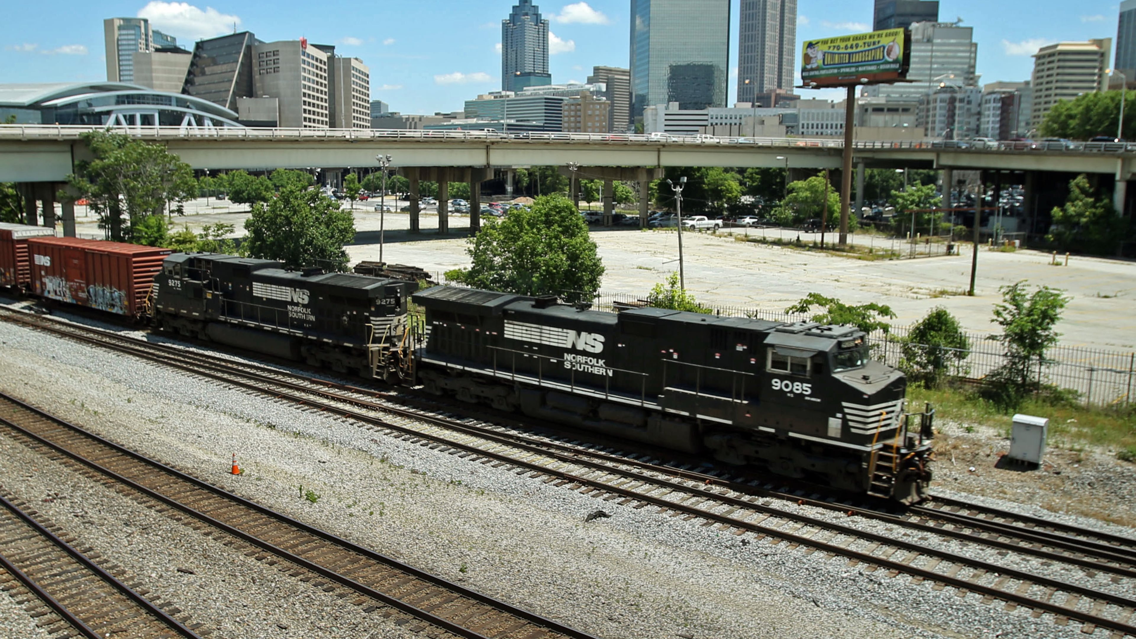 A Norfolk-Southern train travels south close to the Mitchell Street bridge in the Gulch Tuesday afternoon in Atlanta, Ga., May 28, 2013. The Norfolk-Southern route runs north-south through downtown beneath the Georgia World Congress Center (GWCC), through the Gulch, and then onward to parallel MARTA's Red/Gold lines south of downtown. (Jason Getz/AJC)