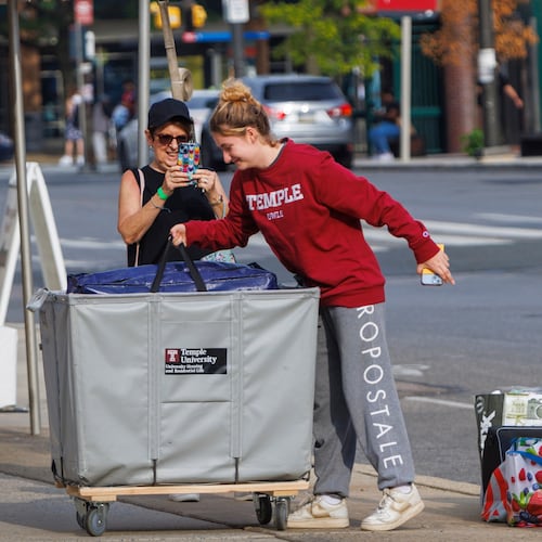FILE - Emily Danenhower, 17, loads her container as grandparents Rena Ruben and Walter McClain help move her into college as students moved into their dorms during move-in-day at Temple University in Philadelphia, on Monday, Aug. 21, 2023. (Alejandro A. Alvarez/The Philadelphia Inquirer via AP, File)