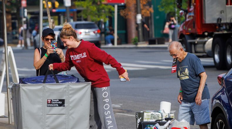 FILE - Emily Danenhower, 17, loads her container as grandparents Rena Ruben and Walter McClain help move her into college as students moved into their dorms during move-in-day at Temple University in Philadelphia, on Monday, Aug. 21, 2023. (Alejandro A. Alvarez/The Philadelphia Inquirer via AP, File)