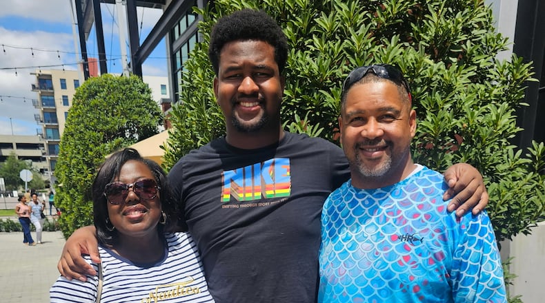 Calvin Dickey Jr., center, poses for a photo with his father, Calvin Dickey Sr., and mother, Nicole Dickey, in Tampa, Fla., on March 31, 2024. (Courtesy of Calvin Dickey Sr. via AP)