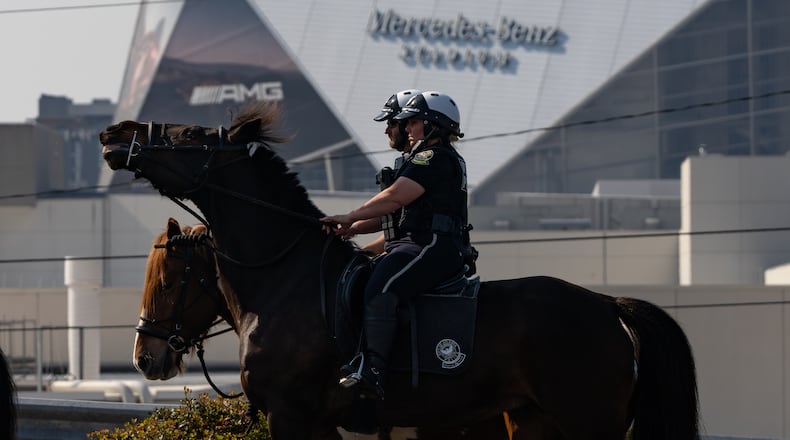 A mounted patrol unit from the Atlanta police conducts a training ride in downtown Atlanta on Thursday, March 26, 2026, with the Cobb County Sheriff's Office to prepare for this summer's FIFA World Cup. (Ben Hendren for the AJC)
