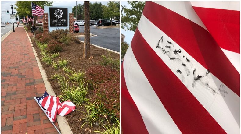 Two American flags were found knocked down and vandalized in Marietta by Alice Summerour, who said that she in the past has put up these flags with the local Kiwanis club. She made the discovery Tuesday, Sept. 4, 2018.