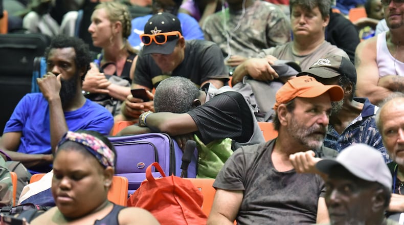 September 3, 2019 Savannah - Hundreds of local residents sit and wait inside the Savannah Civic Center to get a free transportation to inland shelters under mandatory evacuation ahead of Hurricane Dorian on Tuesday, September 3, 2019. Chatham Area Transit (CAT) provided free transportation to residents without private transportation to the Savannah Civic Center to assist in the mandatory evacuation of Chatham County. (Hyosub Shin / Hyosub.Shin@ajc.com)