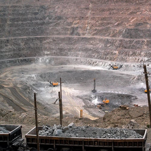 FILE - In this July 6, 2010 file photo, workers use machinery to dig at a rare earth mine in Baiyunebo mining district of Baotou in north China's Inner Mongolia Autonomous Region. (AP Photo, File)