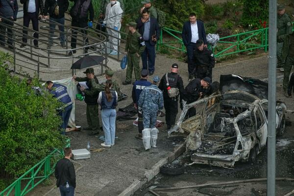 Investigators work at the scene where Lt. Gen. Yaroslav Moskalik, a deputy head of the main operational department in the General Staff of the Russian armed forces, was killed by an explosive device placed in his car in Balashikha, just outside Moscow, Russia, on Friday, April 25, 2025. (AP Photo)