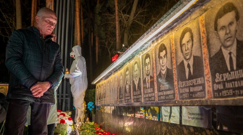 A man looks at a memorial dedicated to firefighters and workers who died after the 1986 Chornobyl (Chernobyl) nuclear disaster, ahead of its 40th anniversary in Slavutych, Ukraine, Saturday, April 25, 2026. Chornobyl is the Ukrainian name for the city. (AP Photo/Dan Bashakov)