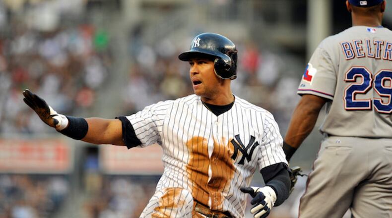Alex Rodriguez of the New York Yankees calls for time after stealing third base against the Texas Rangers at Yankee Stadium in New York on June 15, 2011. (David Pokress/Newsday/TNS)