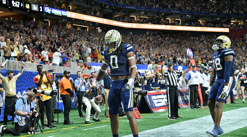 Georgia Tech's wide receiver E.J. Jenkins (0) celebrates after scoring a touchdown past Clemson's safety Andrew Mukuba (1) during the second half of Chick-fil-A Kickoff Game at Mercedes-Benz Stadium in Atlanta on Sept. 5, 2022. Clemson won 41-10 over Georgia Tech. (Hyosub Shin / Hyosub.Shin@ajc.com)
