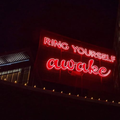 Poet Theresa Davis' words are illuminated in neon at the Goat Farm as part of the "Neon Poetry" project. (Courtesy of Theresa Davis)