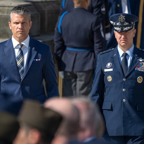 Defense Secretary Pete Hegseth, left, and Chairman of the Joint Chiefs of Staff Gen. Dan Caine, right, arrive for the POW/MIA National Recognition Day Ceremony at the Pentagon, Friday, Sept. 18, 2026, in Washington. (AP Photo/Mark Schiefelbein)
