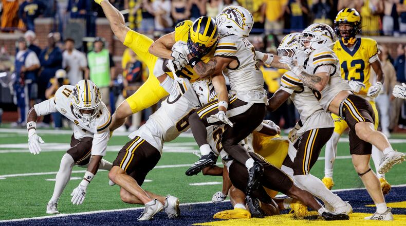Michigan's wide receiver JJ Buchanan (6) makes the game-winning catch to win over Western Michigan with a last-second touchdown during an NCAA college football game in Ann Arbor, Mich., Saturday, Sept. 5 2026. (Jacob Hamilton/Ann Arbor News via AP)