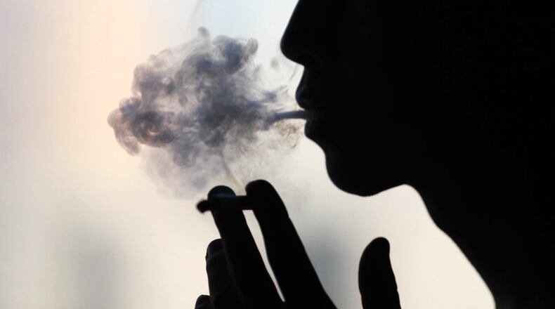 Canton has banned smoking outdoors on all city property including downtown streets and sidewalks, parks and playgrounds. AJC FILE