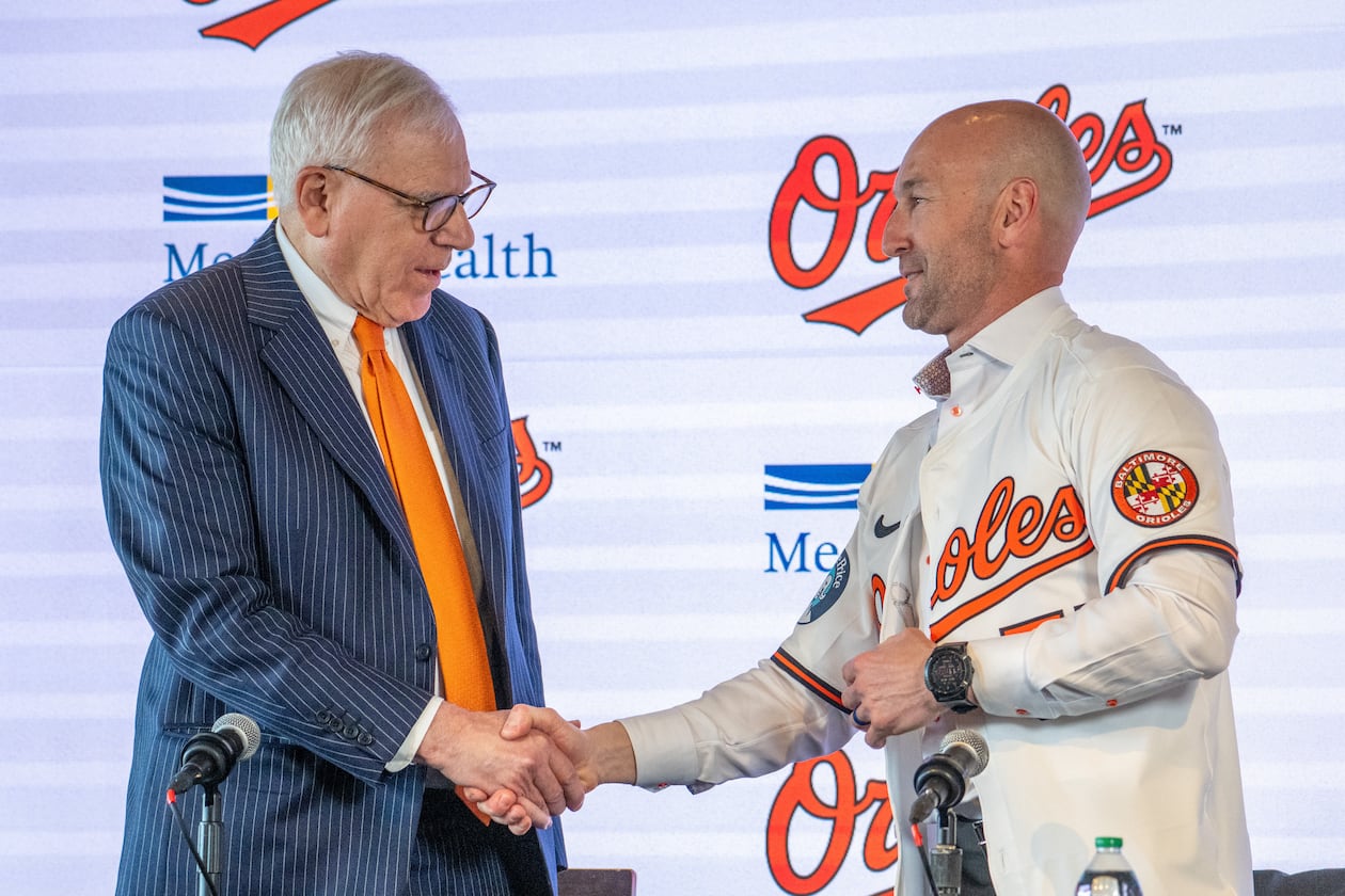 Baltimore Orioles majority owner David Rubenstein, left, congratulates the baseball club's new manager Craig Albernaz during a news conference, Tuesday, Nov. 4, 2025, in Baltimore. (Jerry Jackson/The Baltimore Banner via AP)