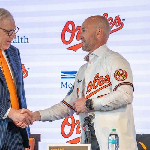 Baltimore Orioles majority owner David Rubenstein, left, congratulates the baseball club's new manager Craig Albernaz during a news conference, Tuesday, Nov. 4, 2025, in Baltimore. (Jerry Jackson/The Baltimore Banner via AP)
