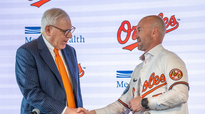 Baltimore Orioles majority owner David Rubenstein, left, congratulates the baseball club's new manager Craig Albernaz during a news conference, Tuesday, Nov. 4, 2025, in Baltimore. (Jerry Jackson/The Baltimore Banner via AP)