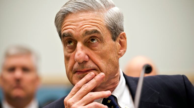 FBI Director Robert Mueller listens as he testifies on Capitol Hill in Washington, Thursday, June 13, 2013, as the House Judiciary Committee held an oversight hearing on the FBI. Mueller is nearing the end of his 12 years as head of the law enforcement agency that is conducting high-profile investigations of the Boston Marathon bombings, the attacks in Benghazi, Libya, and leaks of classified government information. The committee's chairman, Rep. Bob Goodlatte, R-Va., said when it comes to national security leaks, it's important to balance the need to protect secrecy with the need to let the news media do their job. (AP Photo/J. Scott Applewhite)