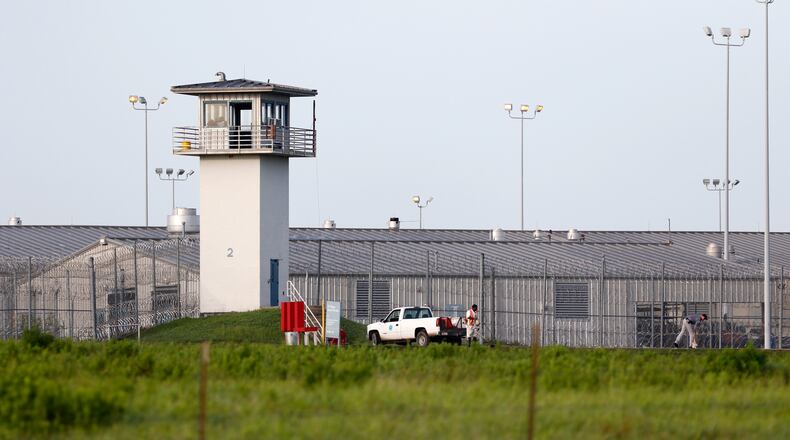 FILE - An inmate works outdoors during a hot summer day outside a Texas prison unit in Huntsville, Texas, on June 25, 2015. (Rose Baca/The Dallas Morning News via AP, File)