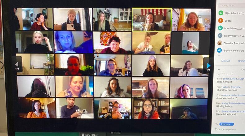 In this March 16, 2020 photo provided by Jamie Lee Finch, a laptop on a desk in Nashville, Tenn., showing people gathered together online for a virtual happy hour is shown amid the coronavirus pandemic. (Jamie Lee Finch via AP)