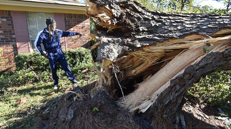 October 9, 2016 Savannah - Eric Riley surveys the damage from Hurricane Matthew in Savannah on Sunday, October 9, 2016. HYOSUB SHIN / HSHIN@AJC.COM