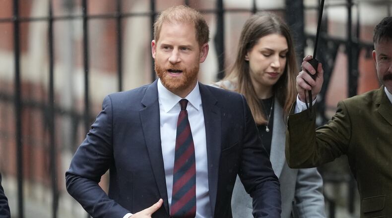 FILE - Britain's Prince Harry arrives at London's High Court to lead a group, including Elton John and Elizabeth Hurley, accusing the Daily Mail's publisher of privacy invasion through unlawful tactics in a trial that is part of a wider phone hacking scandal in London, on Jan. 21, 2026. (AP Photo/Kirsty Wigglesworth, File)