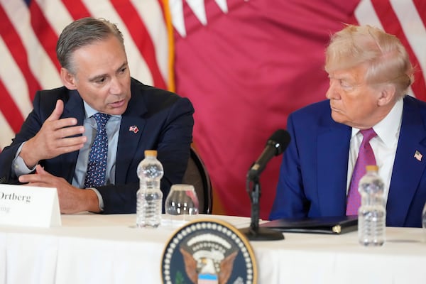 Kelly Ortberg President and CEO of Boeing speaks next to President Donald Trump during a business roundtable, Thursday, May 15, 2025, in Doha, Qatar. (AP Photo/Alex Brandon)