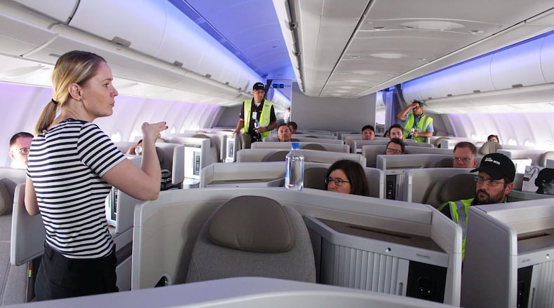 Silvia Ustupska, A330 marketing manager, left, gives a tour of the A330neo jetliner at Atlanta’s Hartsfield-Jackson International Airport. Jenna Eason / Jenna.Eason@coxinc.com