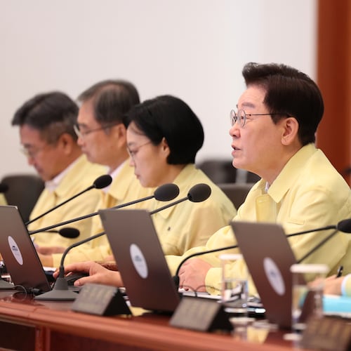 South Korean President Lee Jae-myung, second from right, speaks during a cabinet meeting at the presidential office in Seoul, South Korea, Tuesday, Aug. 18, 2026. (Yonhap via AP)