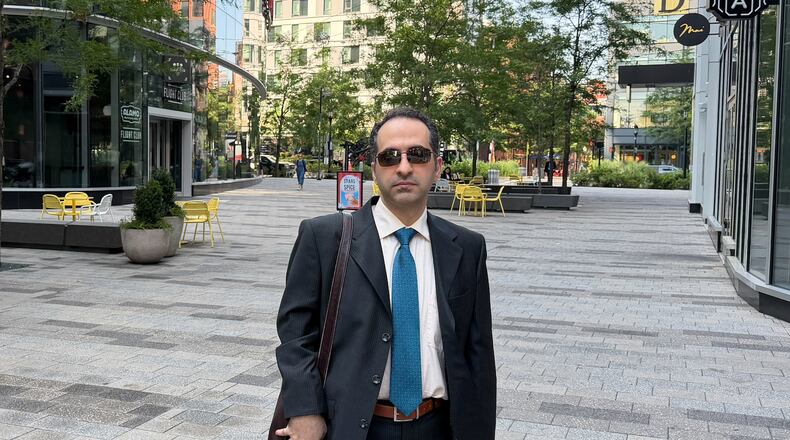 Iranian American defendant Mahdi Mohammad Sadeghi poses for a photo Friday, July 10, 2026, before heading into federal court in Boston. (AP Photo/Michael Casey)