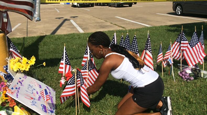 US Army veteran Diondra Pointer pays her respects. Photo: Jennifer Brett
