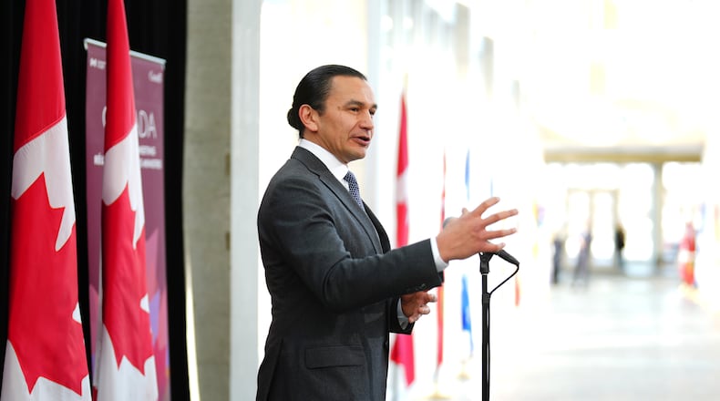 FILE - Manitoba Premier Wab Kinew talks to media as he arrives for a first ministers meeting in Ottawa on Jan.15, 2025. (Sean Kilpatrick/The Canadian Press via AP, File)
