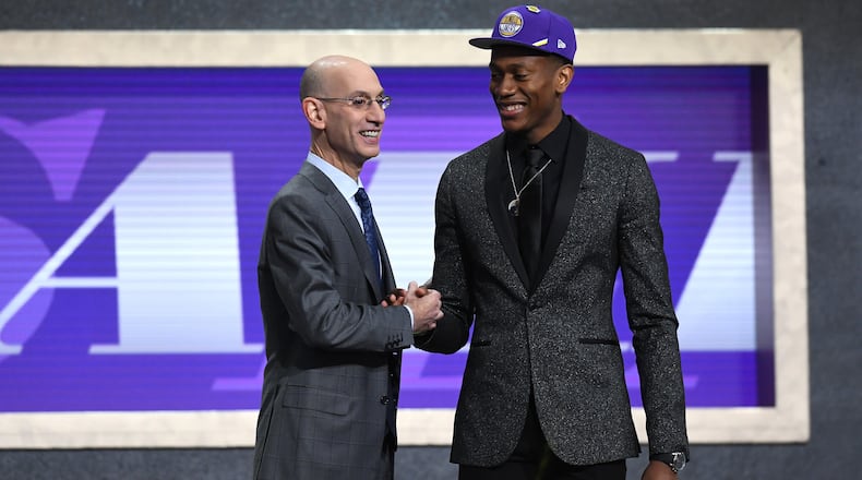De'Andre Hunter poses with NBA Commissioner Adam Silver after being drafted with the fourth overall pick by the Los Angeles Lakers during the 2019 NBA Draft at the Barclays Center on June 20, 2019 in the Brooklyn borough of New York City.